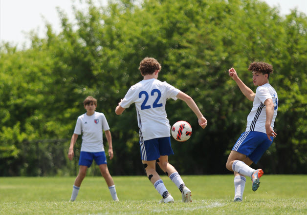 HNFC travel team players showing teamwork and camaraderie on the field