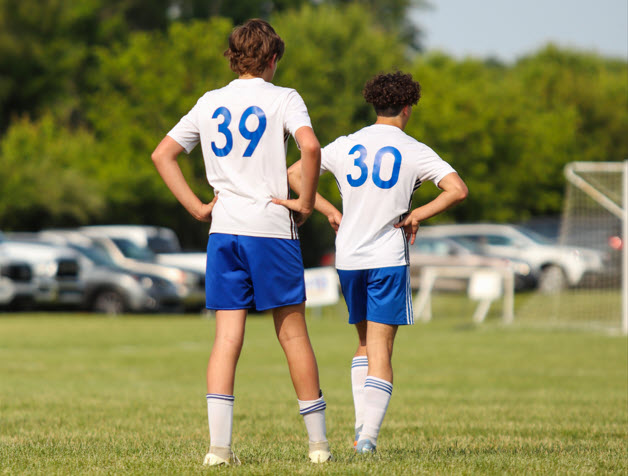 HNFC travel team layers in a huddle
