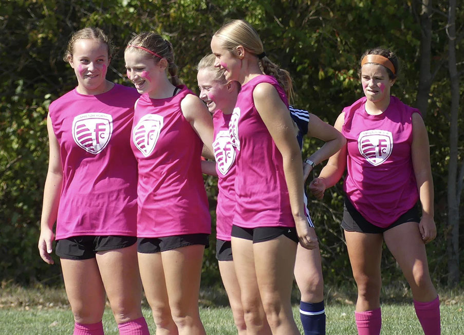 HNFC travel team players showing teamwork and camaraderie on the field